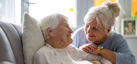 Elderly woman with her caregiver